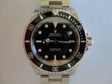 14060M Rolex Submariner overhaul and insurance valuation